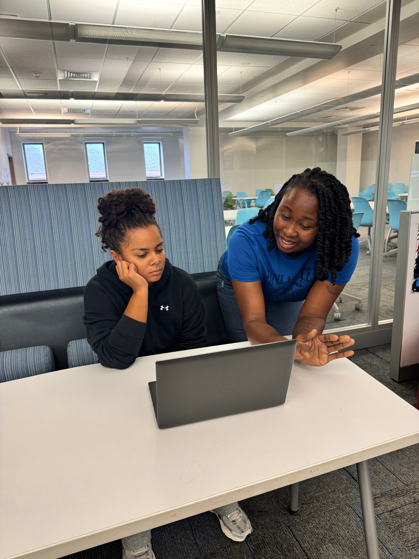 Champions Leadership Network mentor working with a student